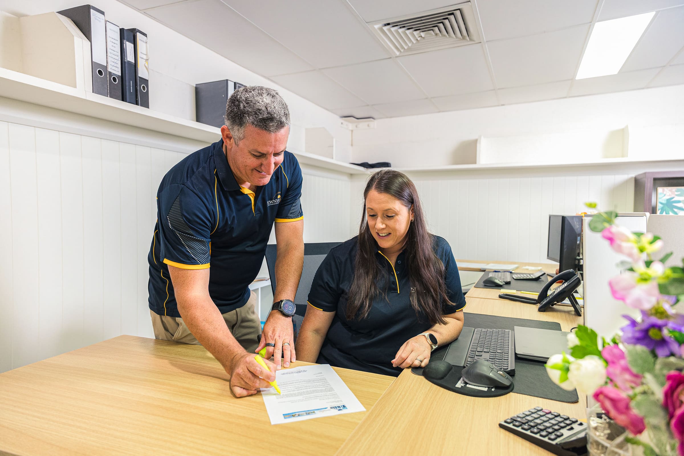 Newnham Constructions team members reviewing plans in the office