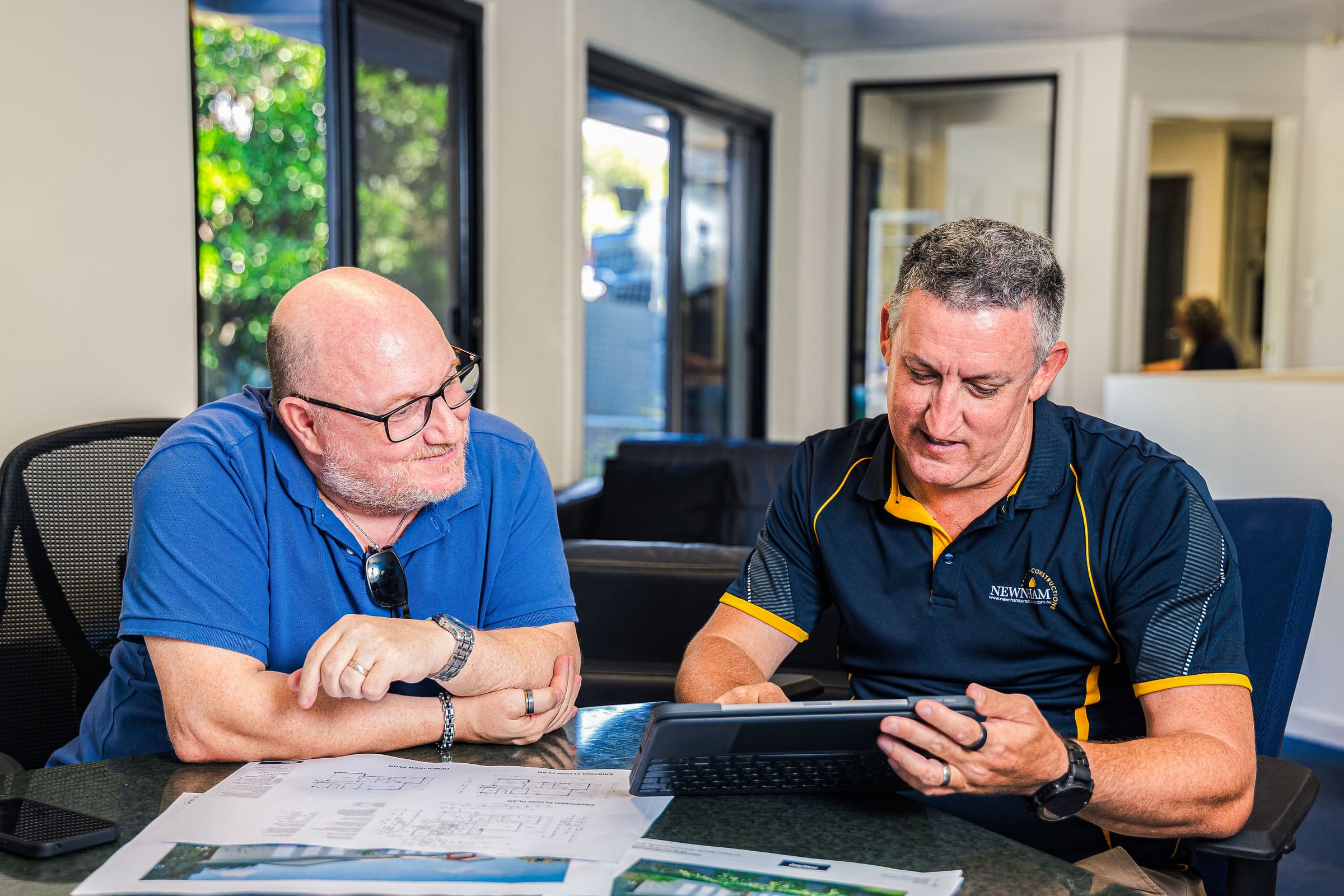 Newnham Constructions reviewing plans with a Gold Coast client